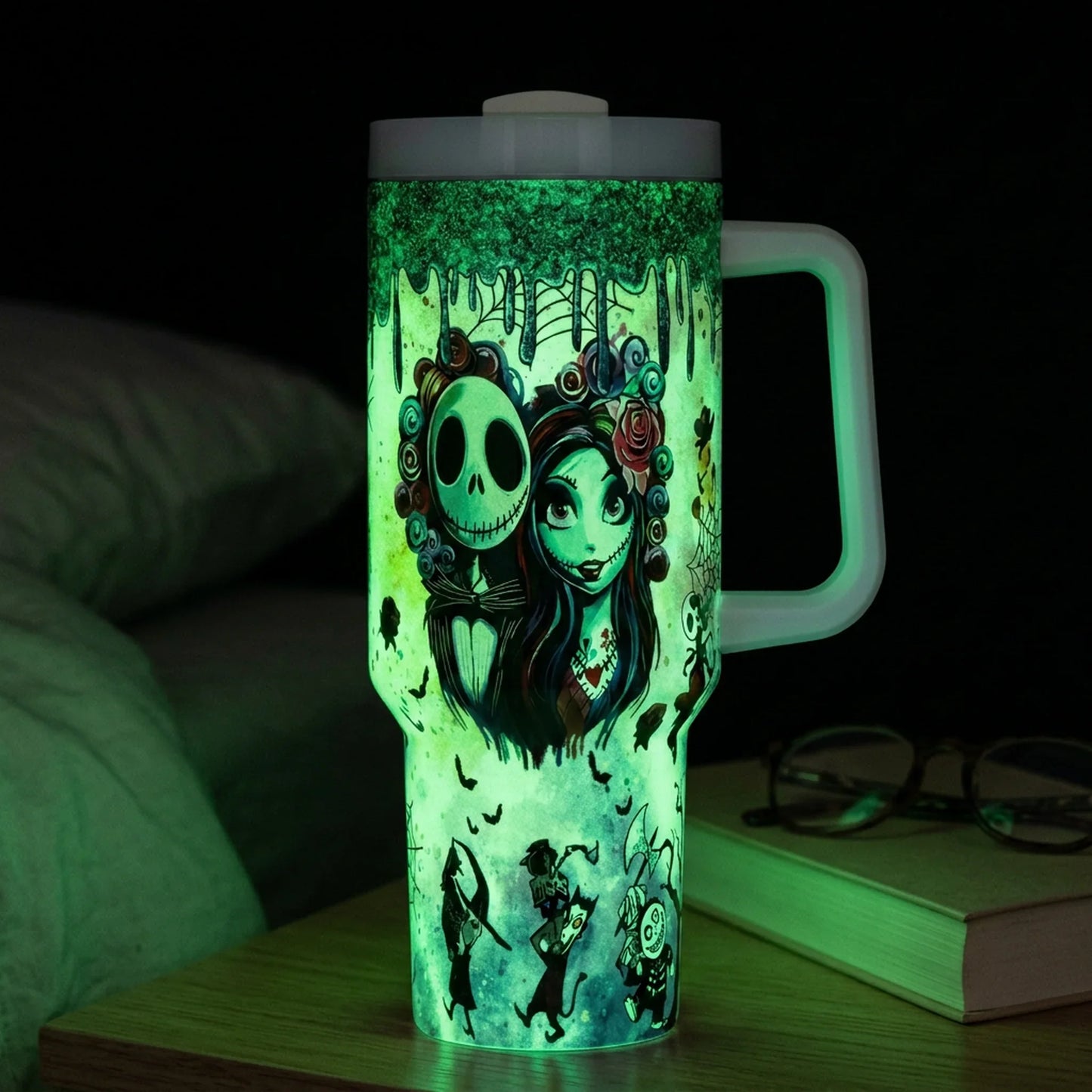 Glow Skeleton Couple 40 Oz Tumbler glowing on a nightstand